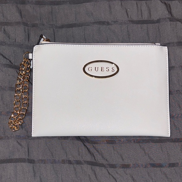Guess Handbags - GUESS Ivory Clutch with Gold Accent